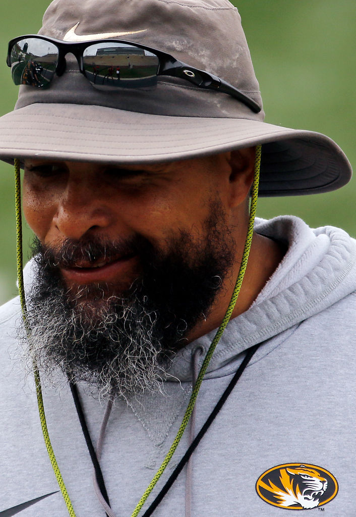 Rohrk Cutchlow talks with players on the sidelines